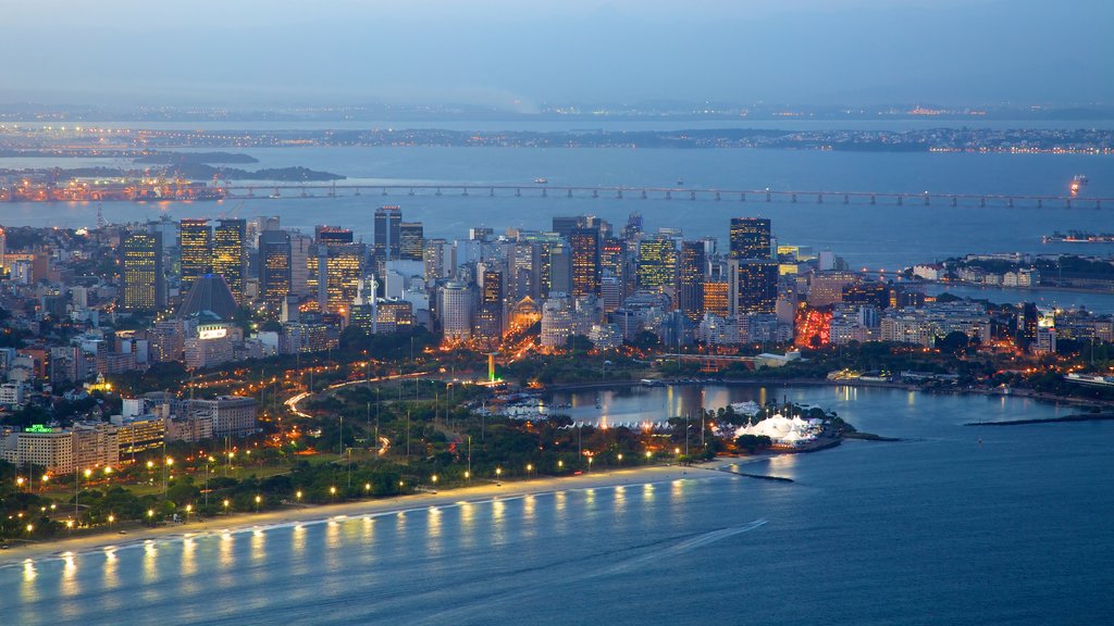 Sugar Loaf Mountain which includes general coastal views, central business district and night scenes