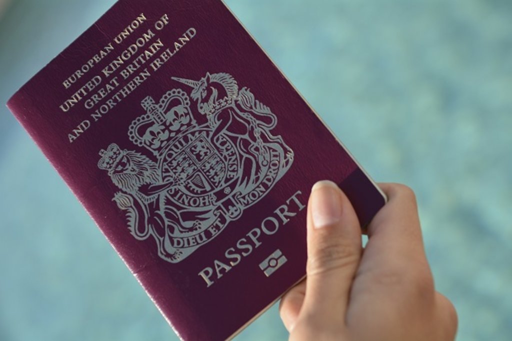 Woman holding a British passport