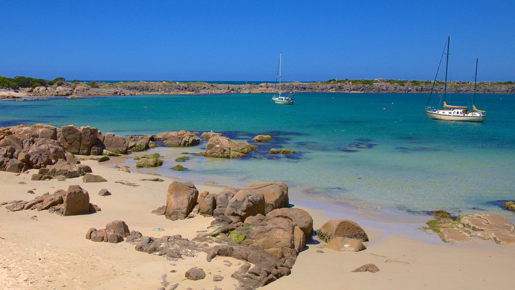 King Island showing a bay or harbor, boating and a beach