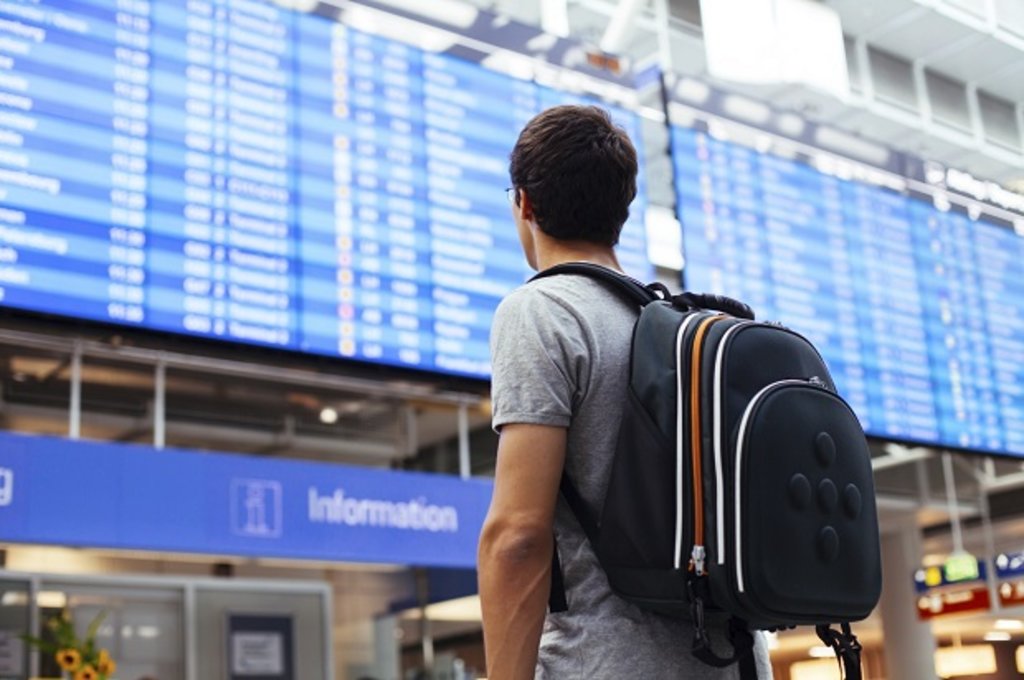 Man with backpack in airport