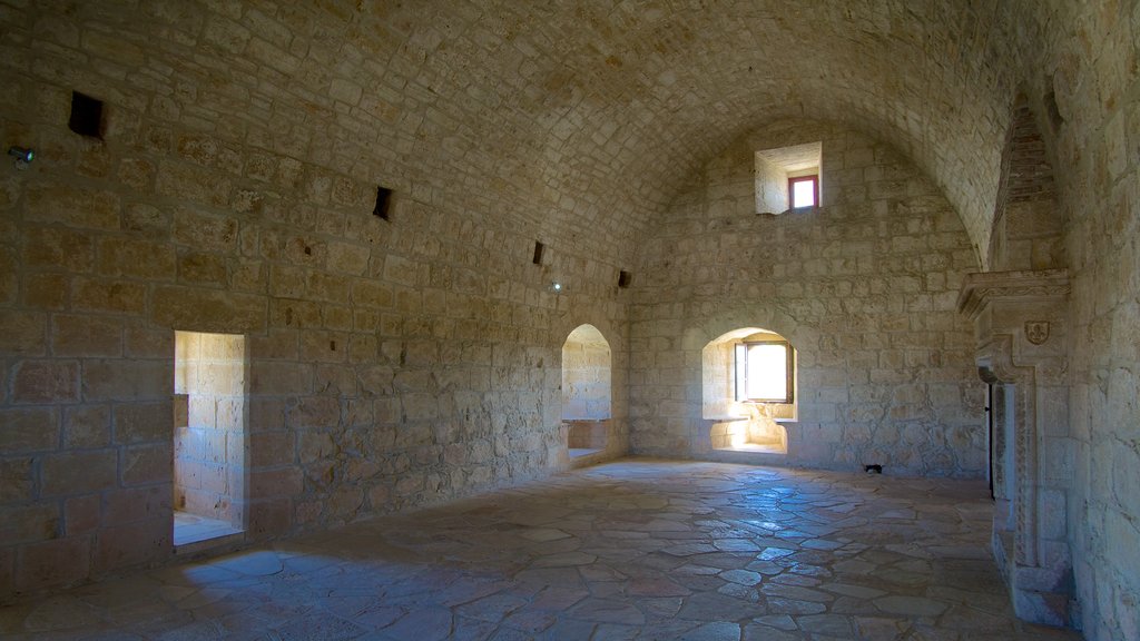 Kolossi Castle which includes interior views, a castle and heritage architecture