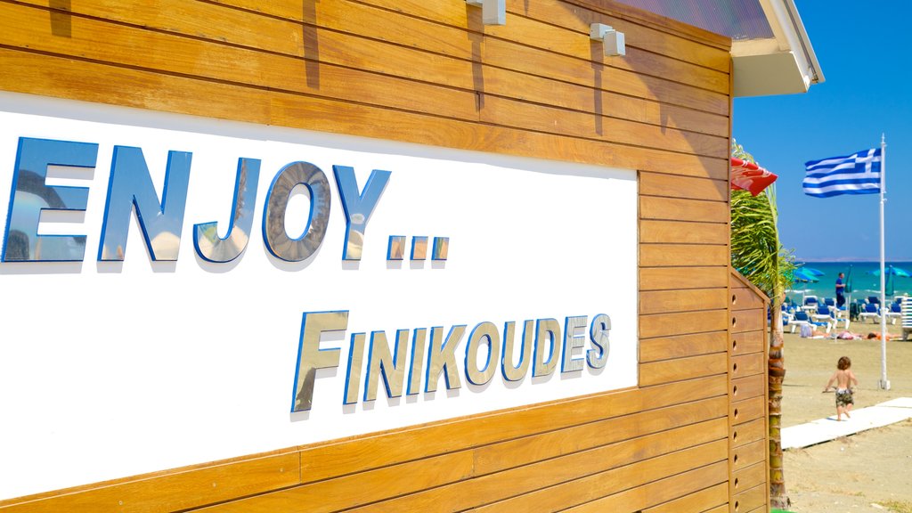 Finikoudes Beach showing signage