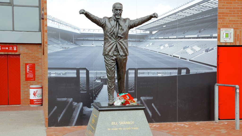 Anfield Road Stadium which includes a memorial and a statue or sculpture