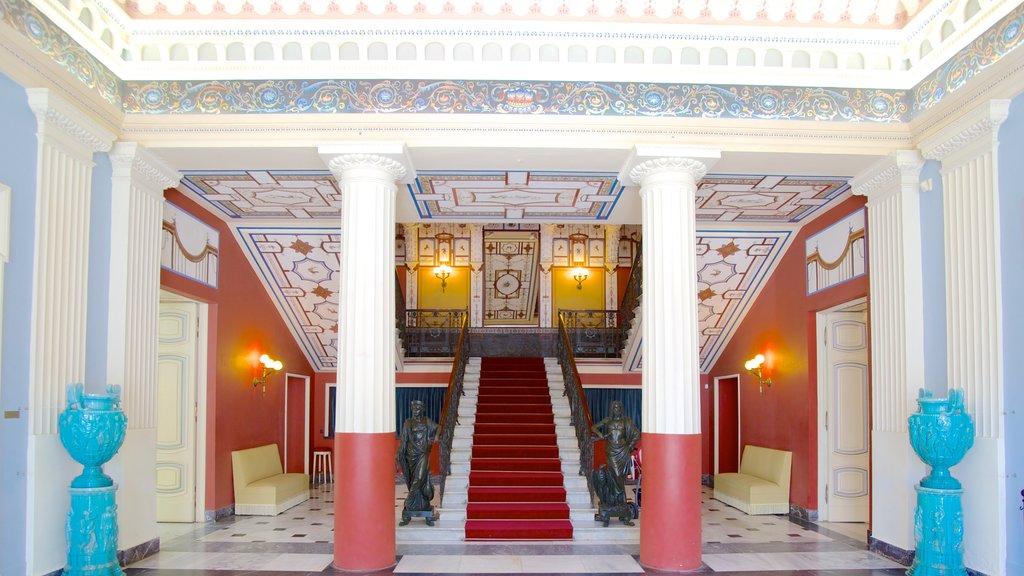 Achilleion featuring a castle and interior views