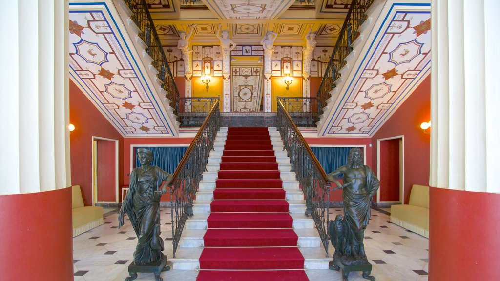 Achilleion featuring a statue or sculpture, interior views and a castle