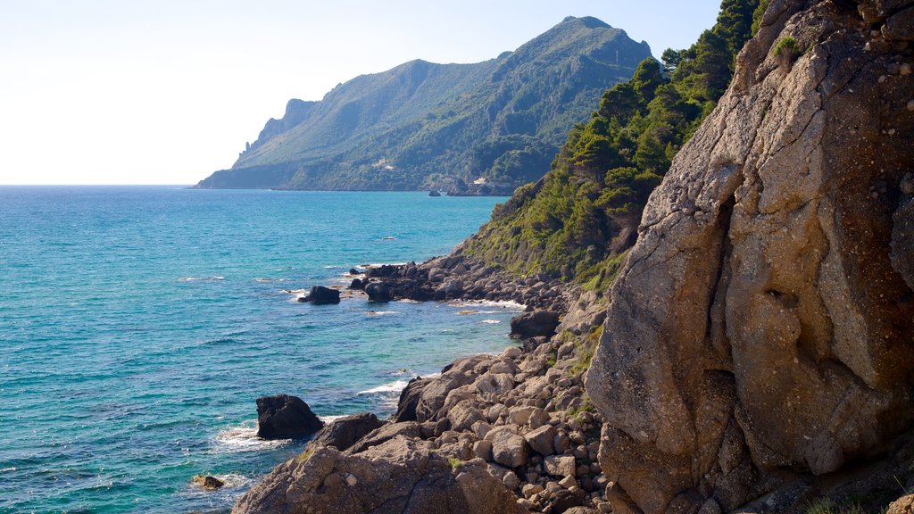 Pelekas Beach showing rocky coastline and landscape views