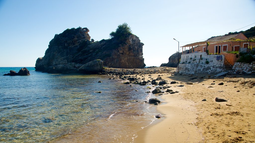 Pelekas Beach showing a coastal town, a sandy beach and landscape views