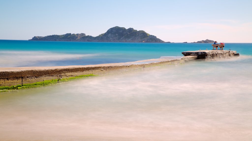 Arillas Beach showing a beach, landscape views and a bay or harbour