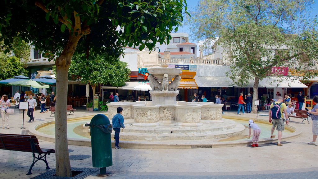 St. Mark\'s Basilica showing a fountain and a square or plaza