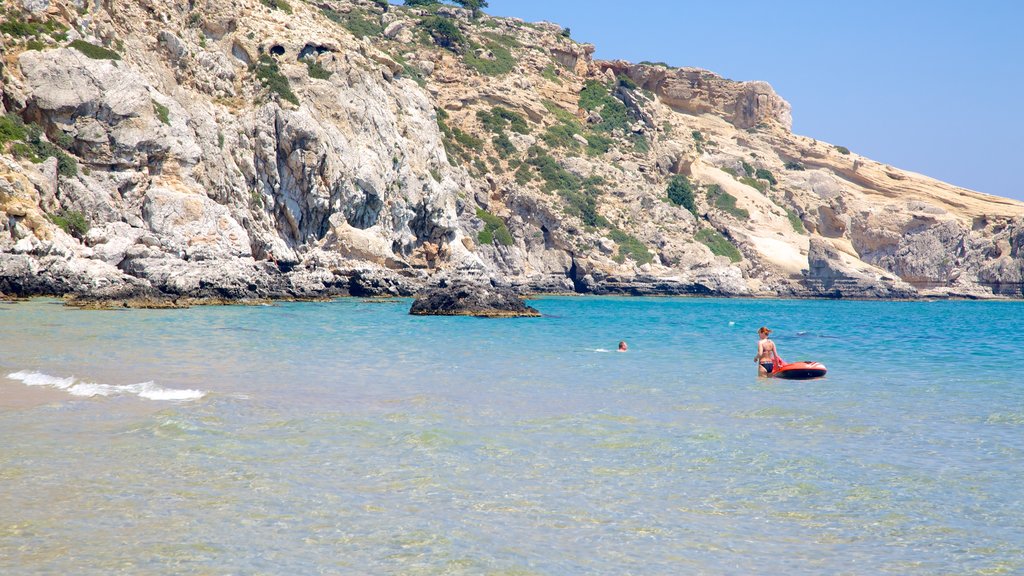 Tsambika Beach showing landscape views, swimming and rugged coastline