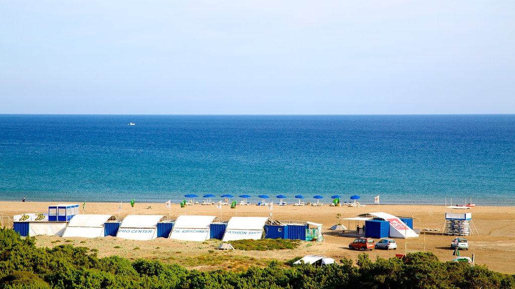 Prassonissi which includes a sandy beach and general coastal views