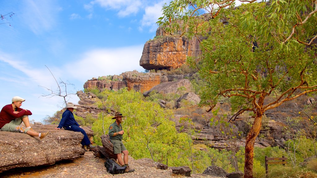 Nourlangie Rock as well as a small group of people