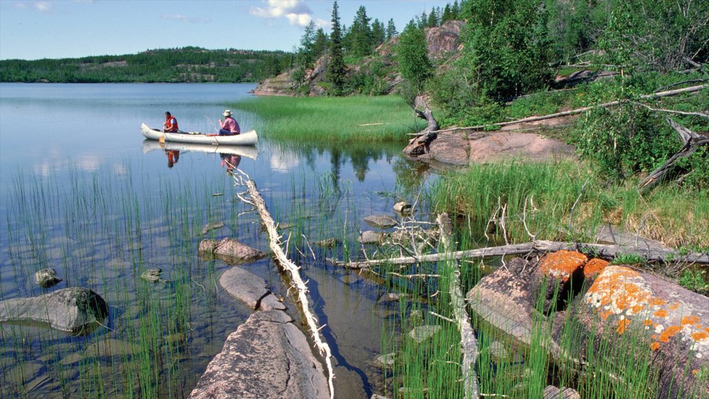 Northwest Territories featuring kayaking or canoeing and a lake or waterhole