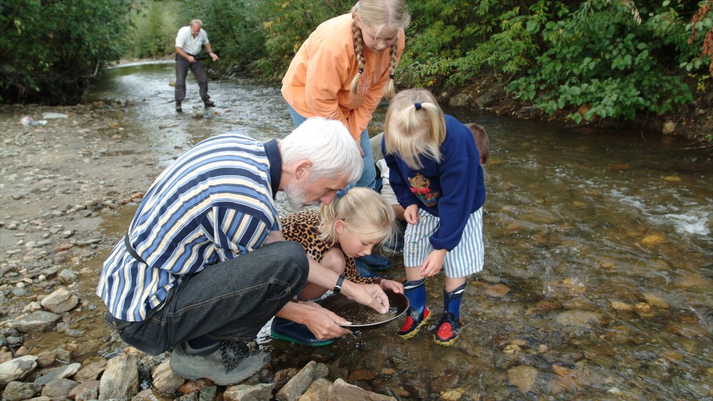 Yukon showing a river or creek as well as a family