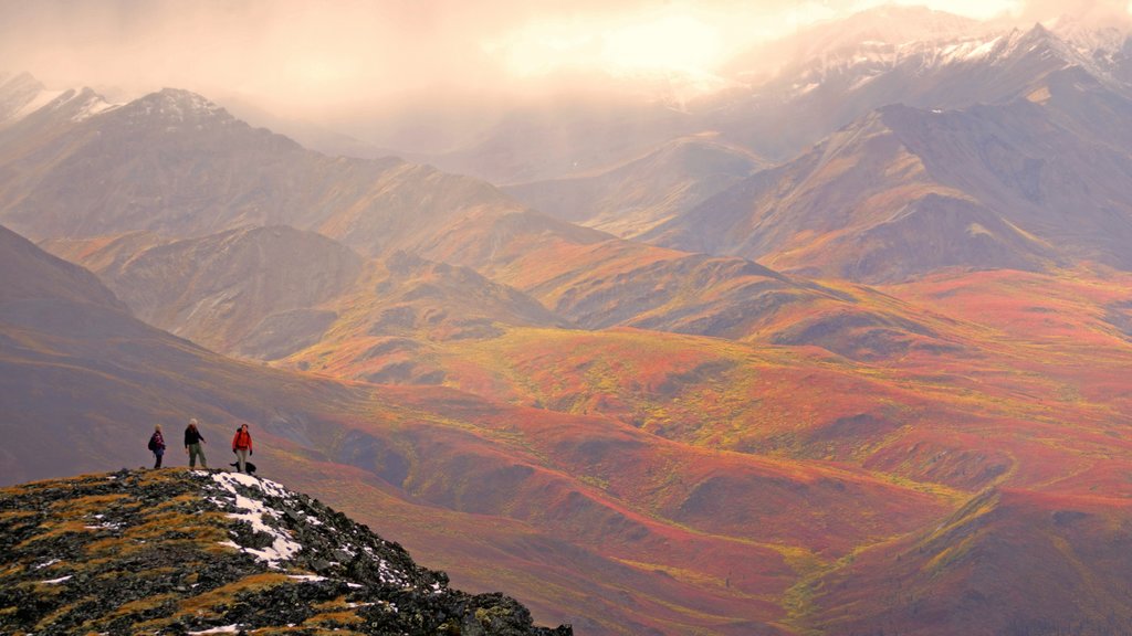 Yukon featuring landscape views and mountains as well as a small group of people