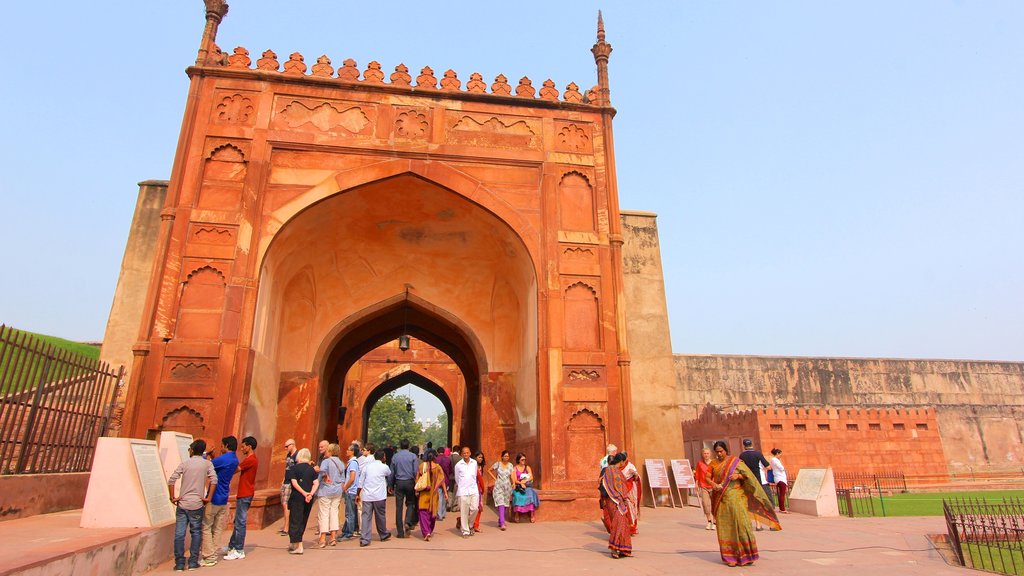 Agra Fort which includes heritage architecture as well as a large group of people