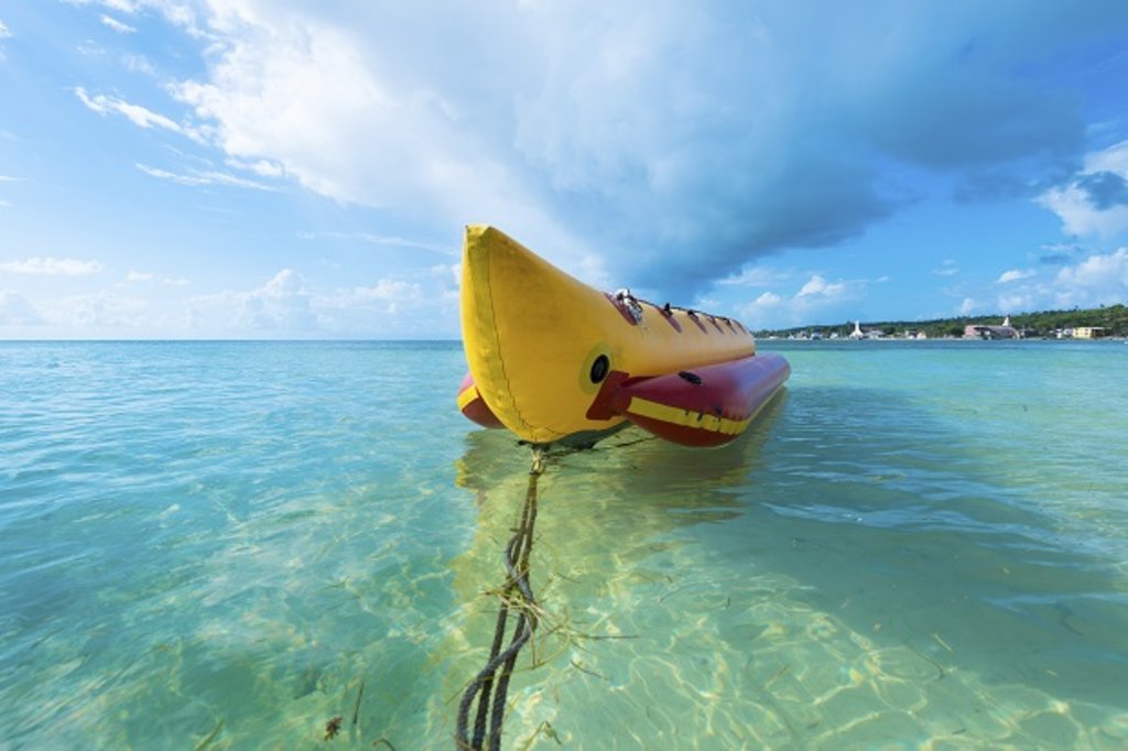 A banana boat in turquoise waters