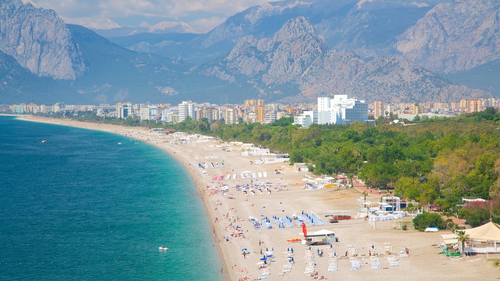 Konyaalti Beach Park showing a beach, a luxury hotel or resort and swimming