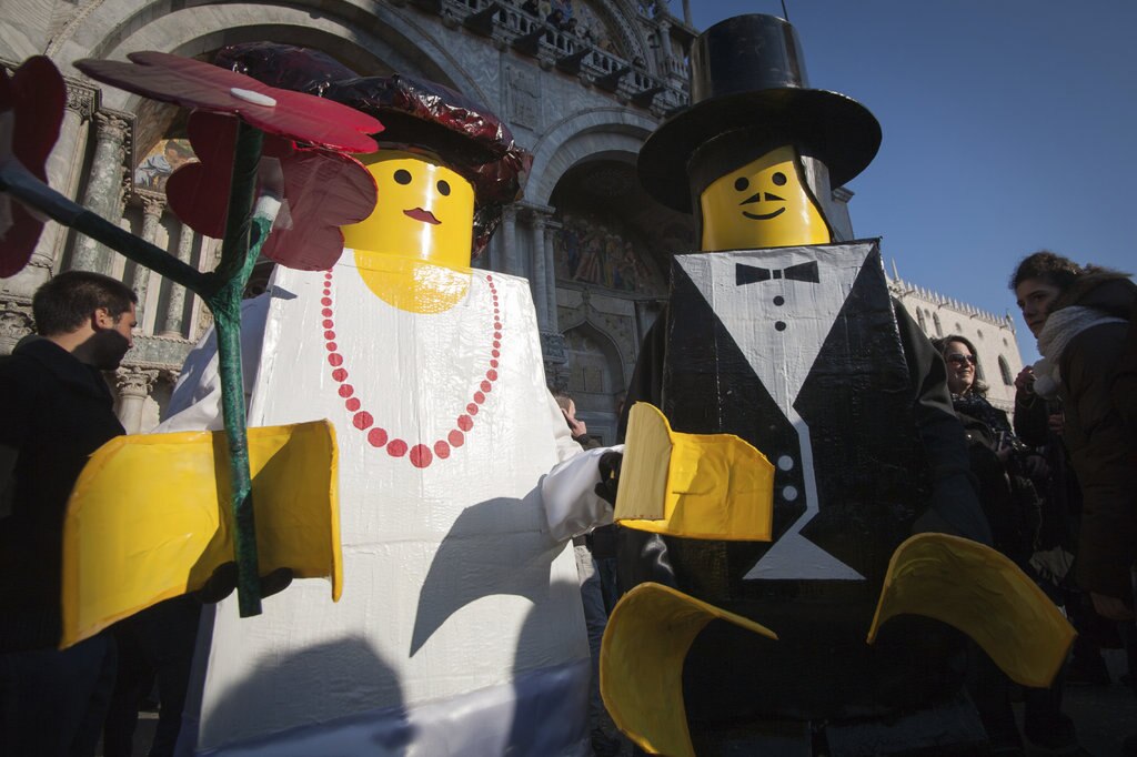 People dressed in Lego costumes
