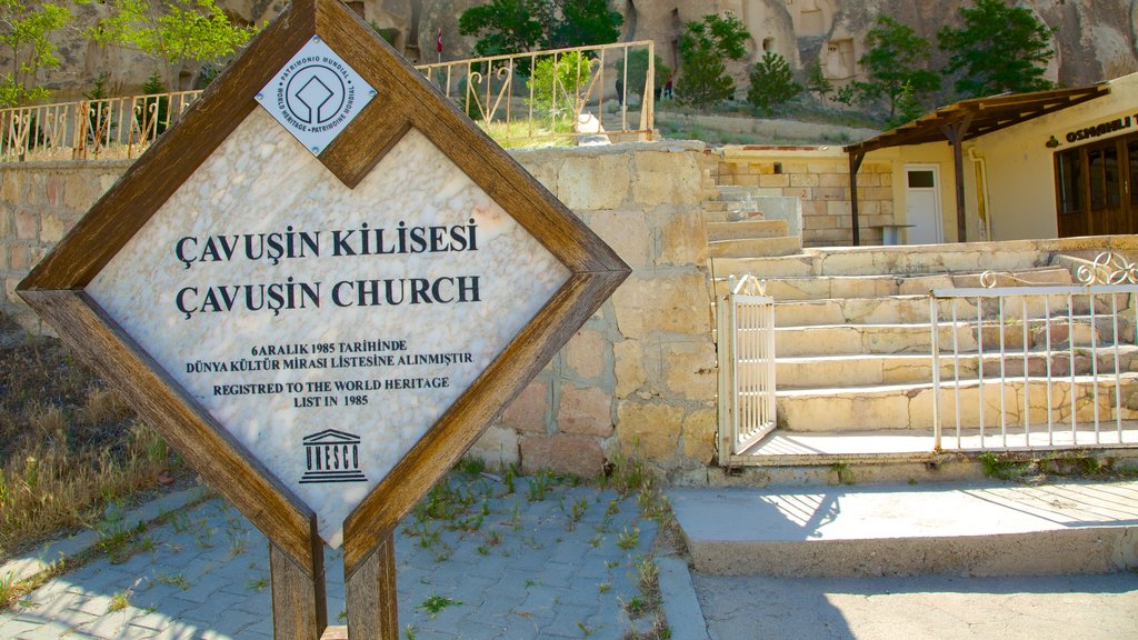 Cavusin Church which includes signage, a church or cathedral and religious elements