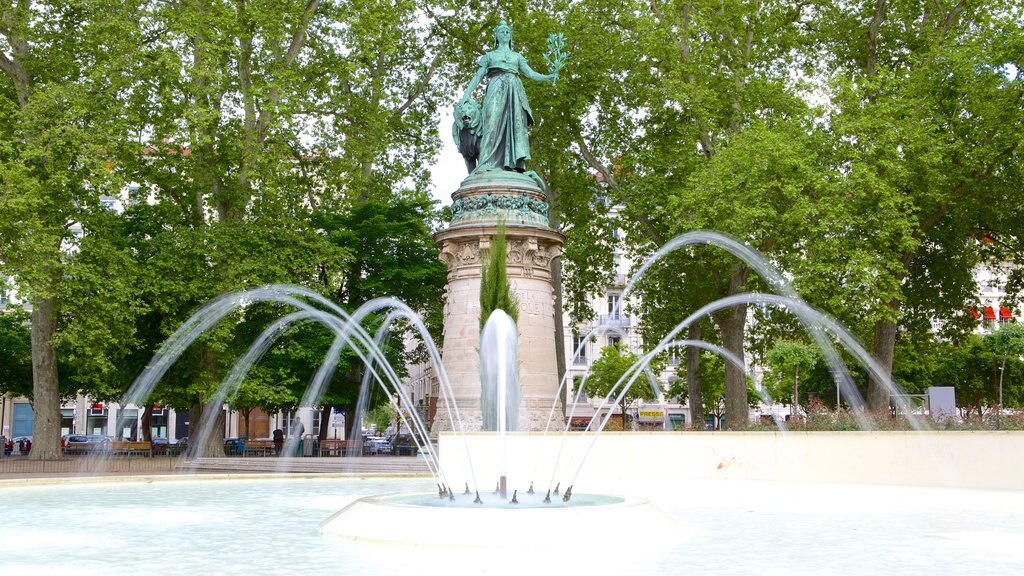 La Presqu\'ile featuring a fountain and a statue or sculpture