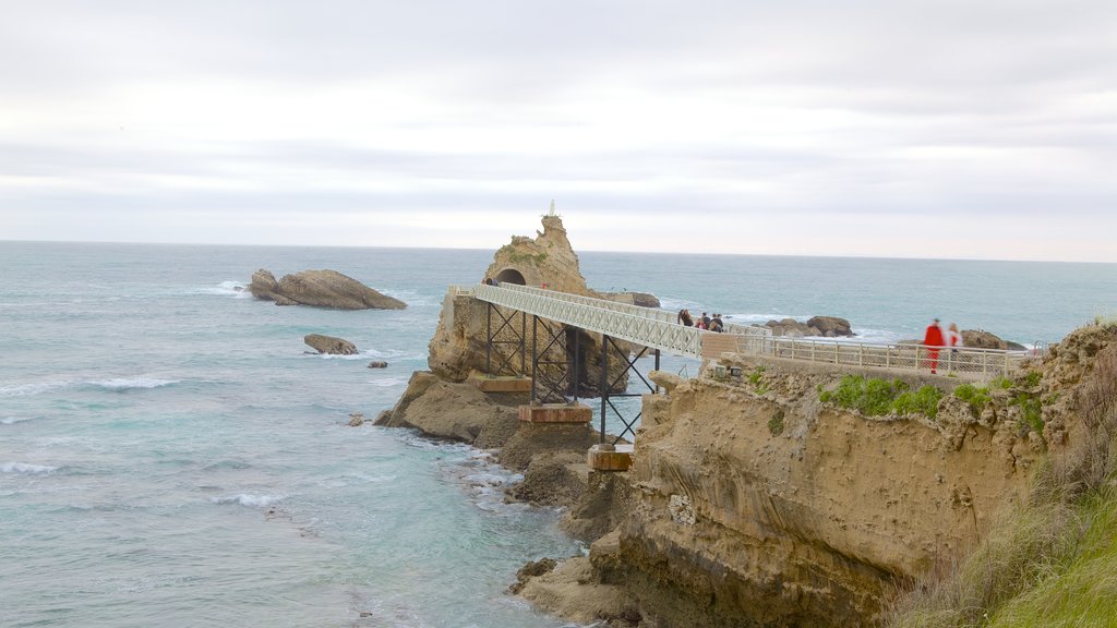 Virgin\'s Rock featuring a bridge, landscape views and rugged coastline