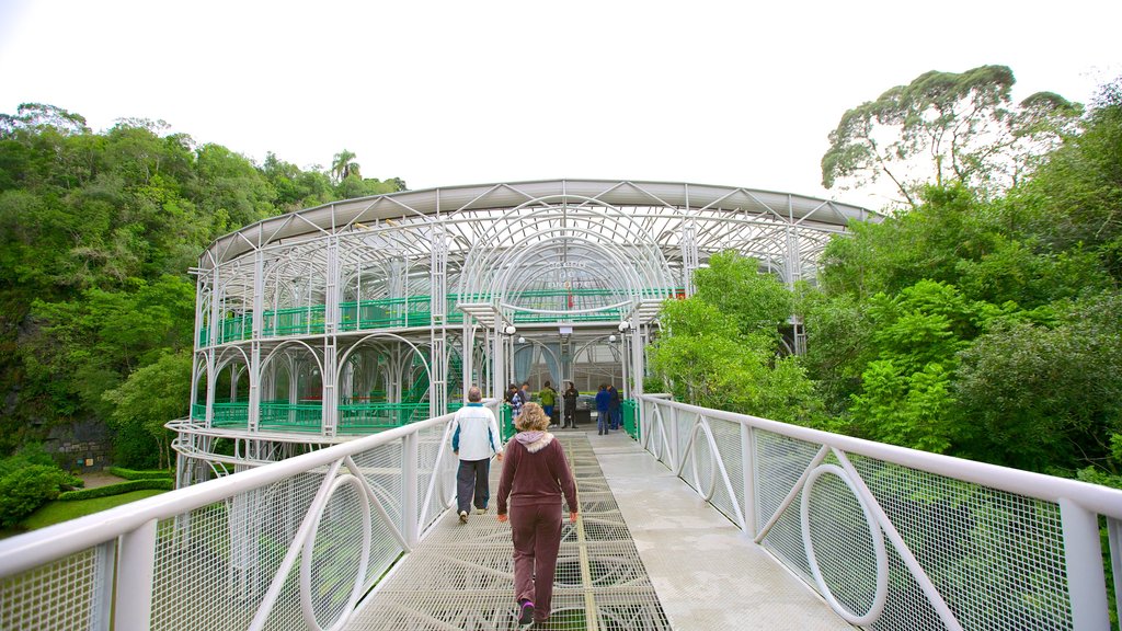 Wire Opera House showing a bridge and modern architecture as well as a small group of people