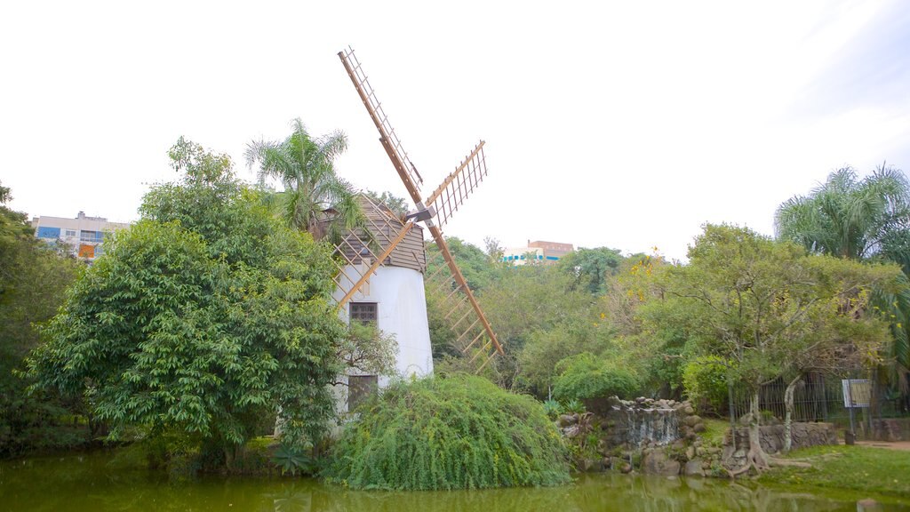 Moinhos de Vento Park showing a garden, a windmill and a lake or waterhole