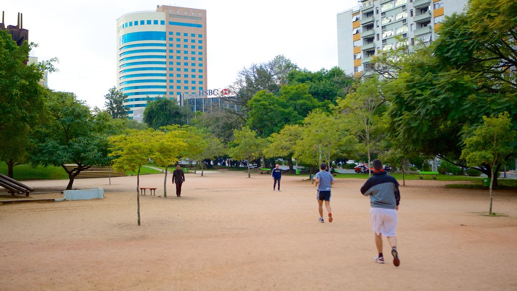 Moinhos de Vento Park featuring hiking or walking and a garden as well as a small group of people