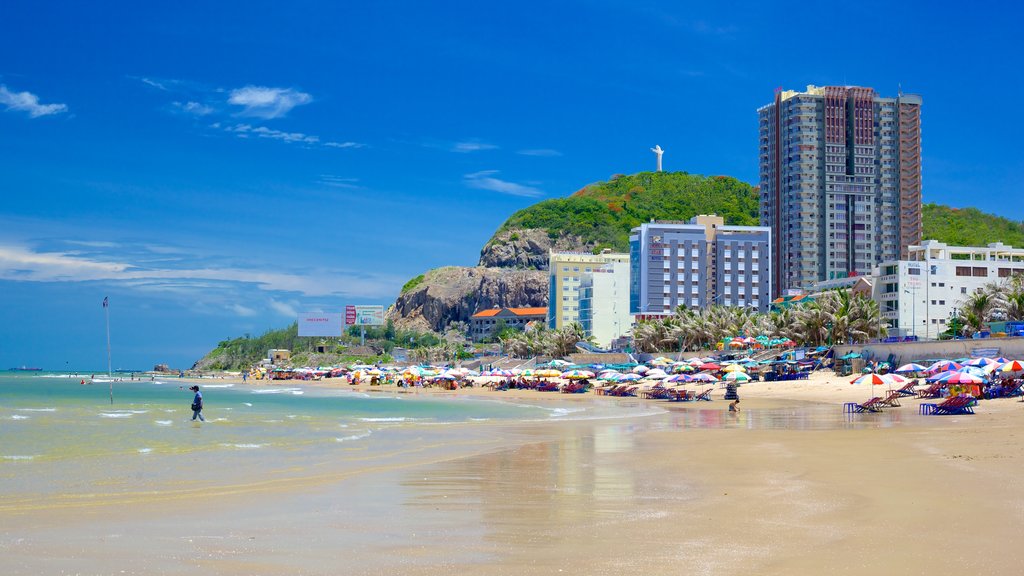 Back Beach showing a sandy beach and a coastal town