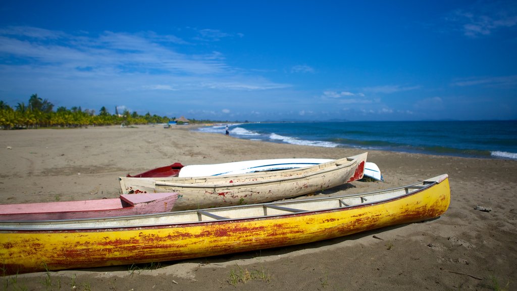 Tela showing a sandy beach and kayaking or canoeing