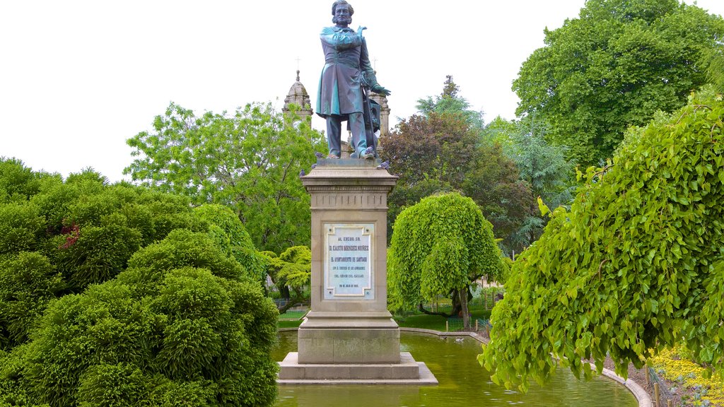 Alameda Park showing a statue or sculpture, a garden and a pond