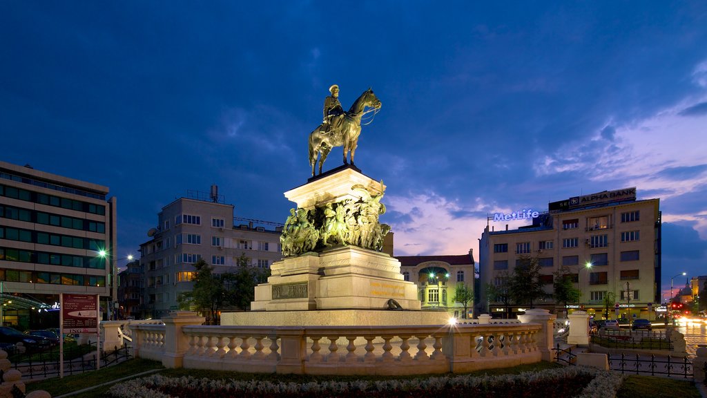 Monument to the Liberating Tsar which includes a statue or sculpture and night scenes