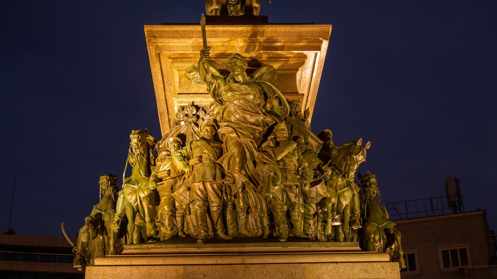 Monument to the Liberating Tsar showing night scenes and a statue or sculpture