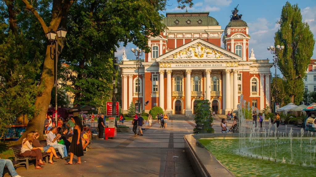 Prince Alexander of Battenberg Square which includes a fountain and a square or plaza as well as a large group of people