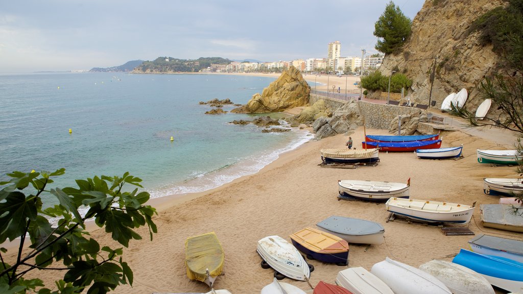 Lloret de Mar Beach showing a sandy beach, boating and landscape views