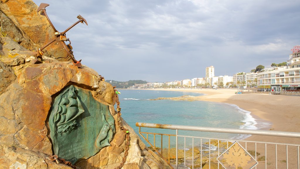 Lloret de Mar Beach showing a sandy beach and outdoor art