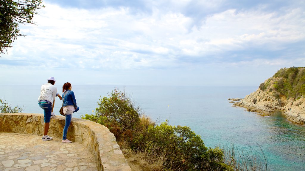 Sant Joan Castle which includes general coastal views and views as well as a couple