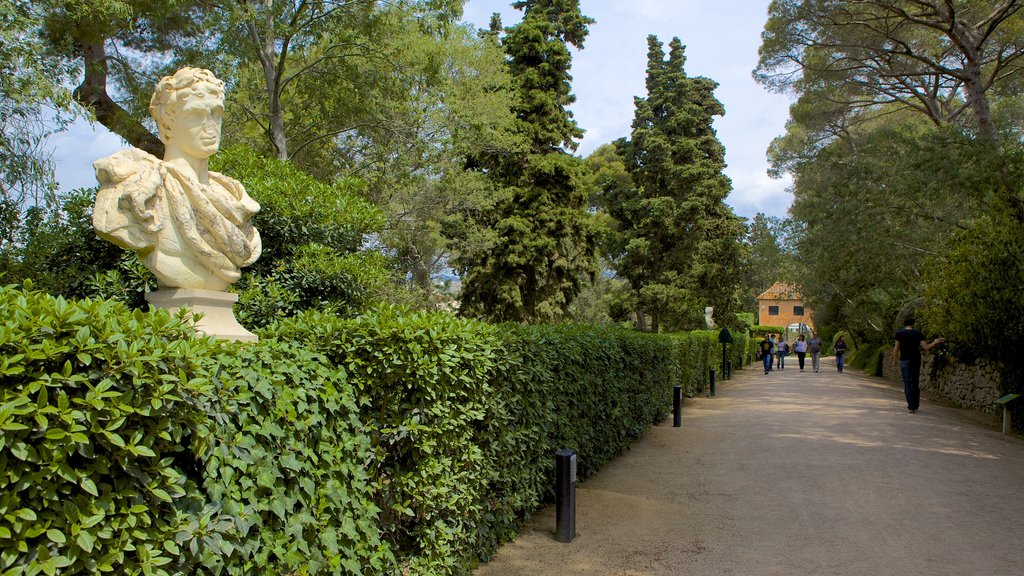 Santa Clotilde Gardens which includes a statue or sculpture, a park and outdoor art