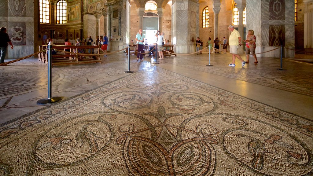 Basilica of San Vitale featuring a church or cathedral, religious elements and interior views