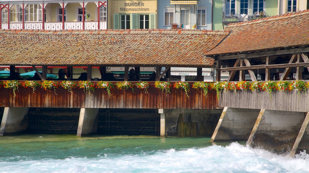 Thun which includes a river or creek and a house