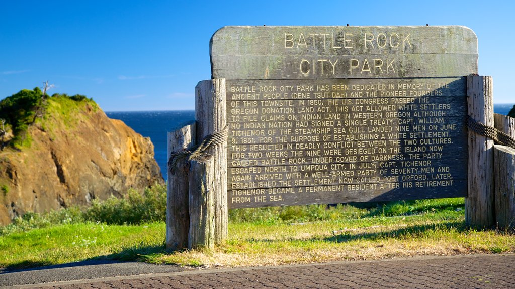 Port Orford showing a memorial, a monument and signage