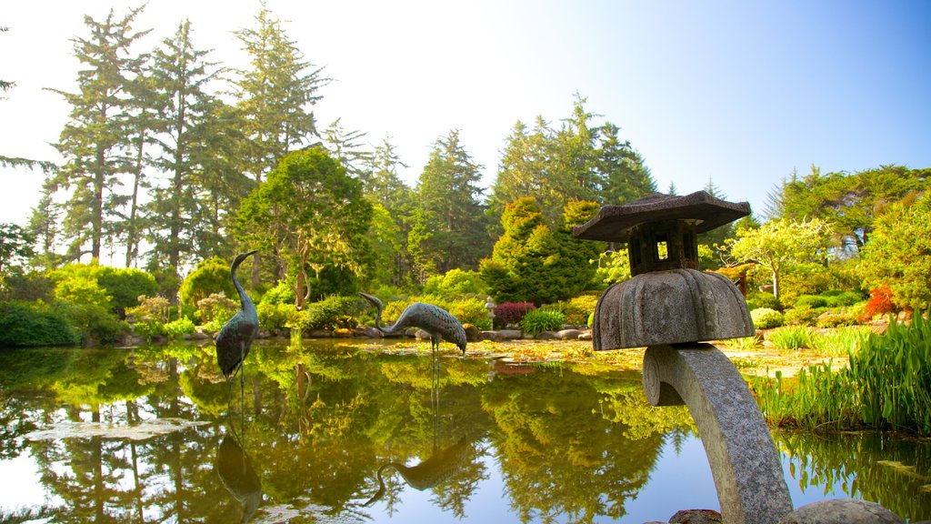 Shore Acres State Park featuring a pond and a statue or sculpture