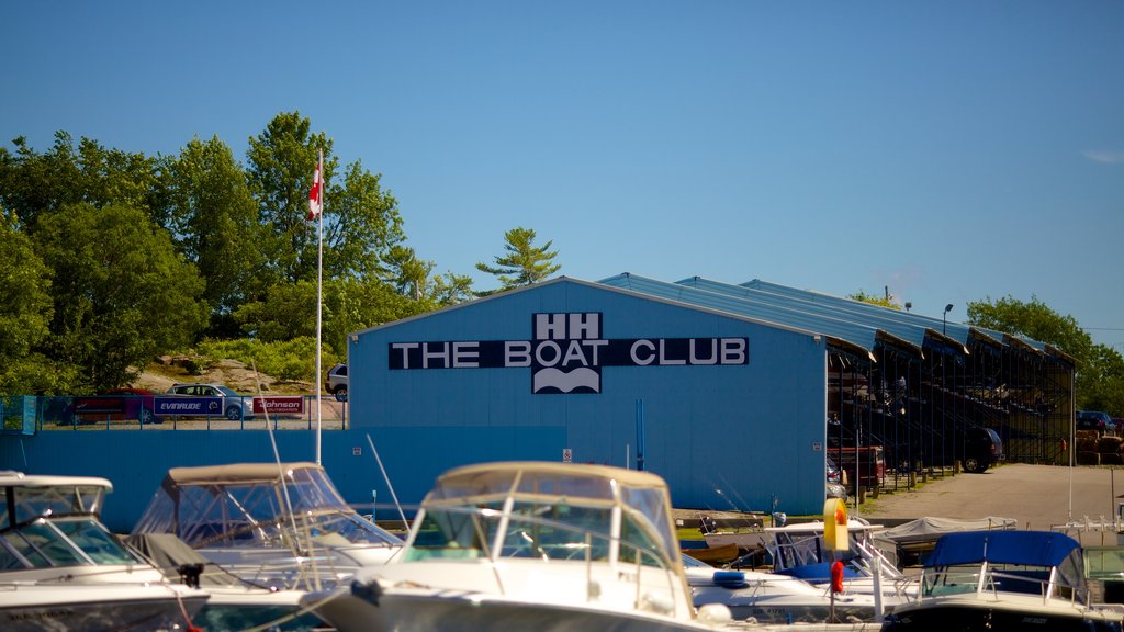 Honey Harbour showing signage and a bay or harbour