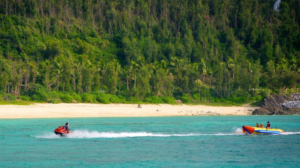 Busena Marine Park showing a beach, tropical scenes and jet skiing