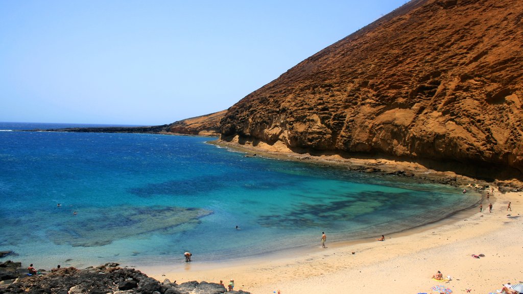 Lanzarote showing mountains and a beach