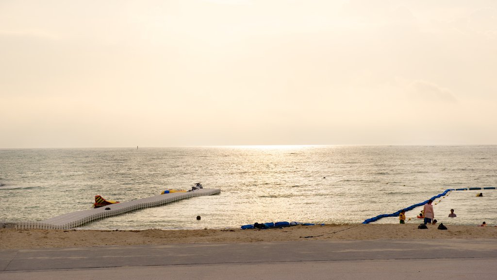 Okinawa showing a beach and a sunset