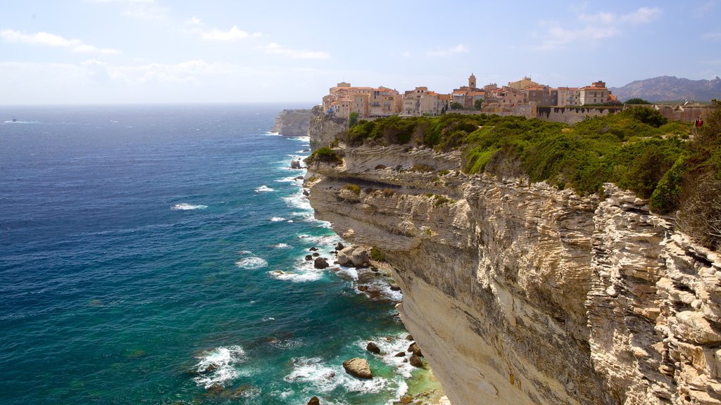 Bonifacio which includes a coastal town and rocky coastline