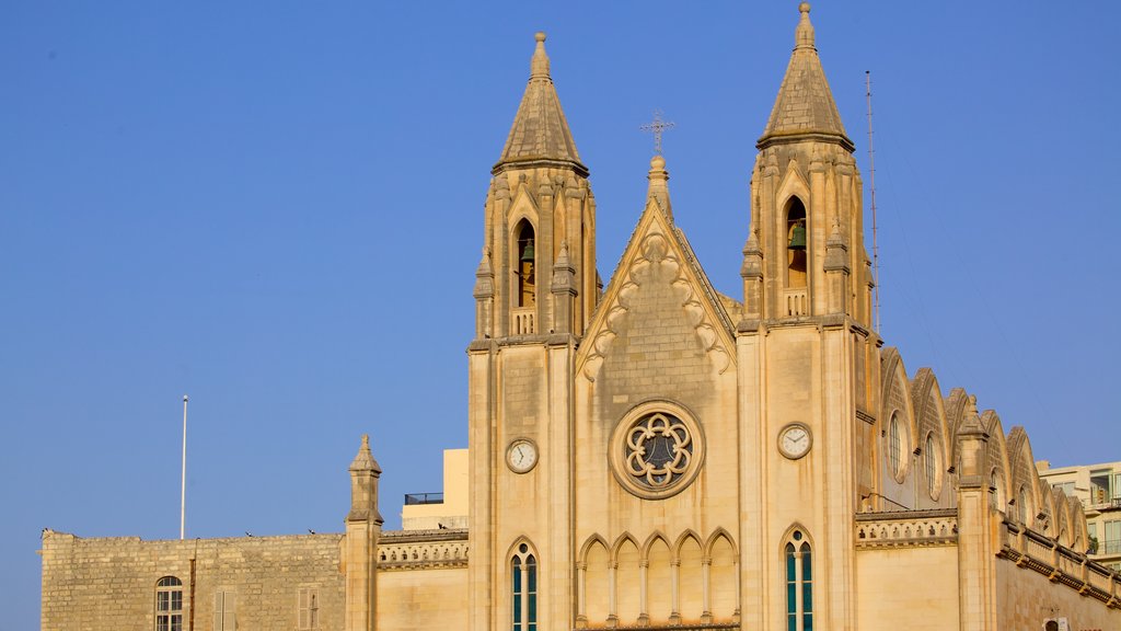 Balluta Bay showing heritage architecture and a church or cathedral