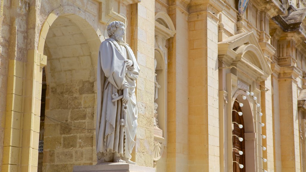 Rabat featuring a statue or sculpture, a church or cathedral and heritage architecture